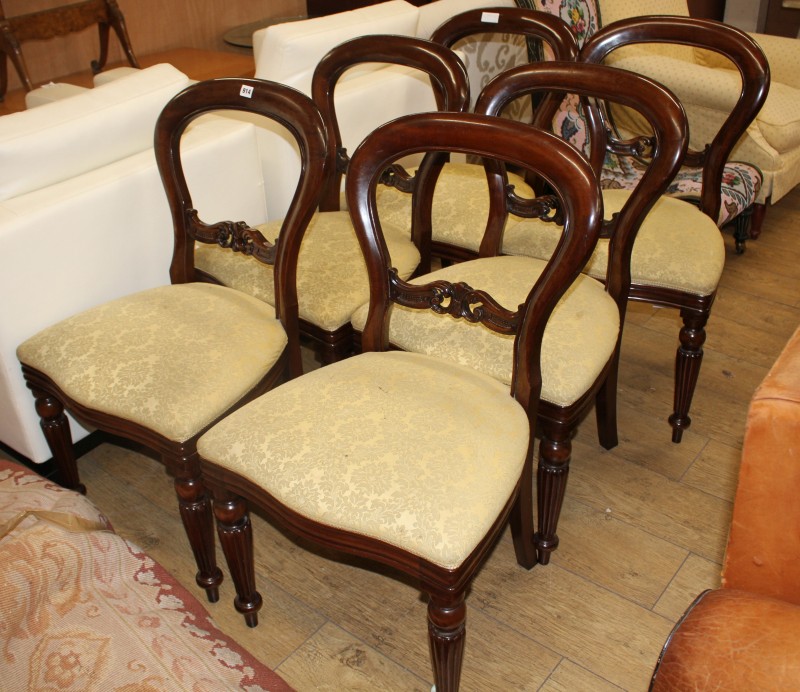 A set of six Victorian style mahogany balloon back dining chairs